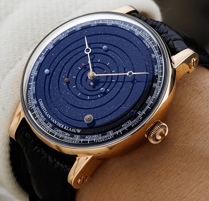 Rose gold planetarium on the wrist