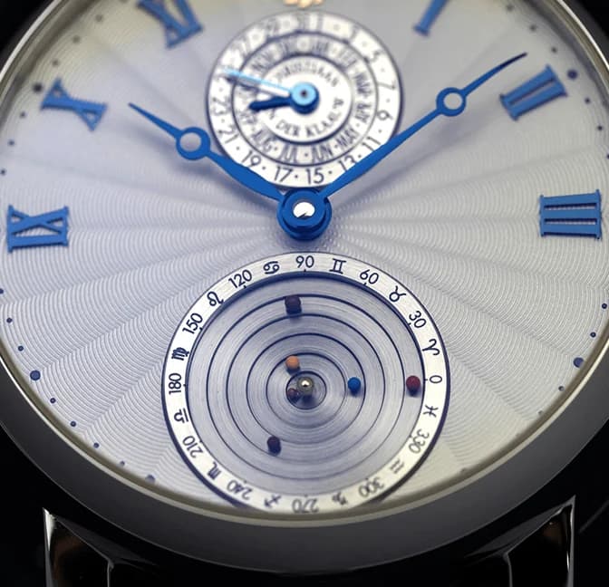 Planetarium sub-dial and blue Roman numerals on a guilloché dial