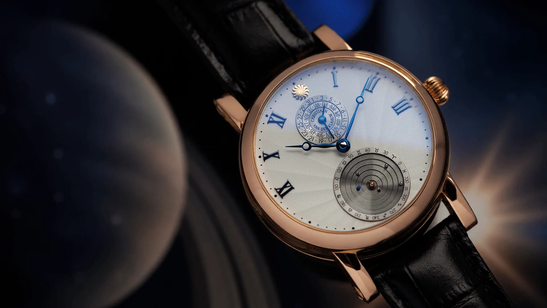 Rose gold planetarium with a guilloché dial in front of a planet