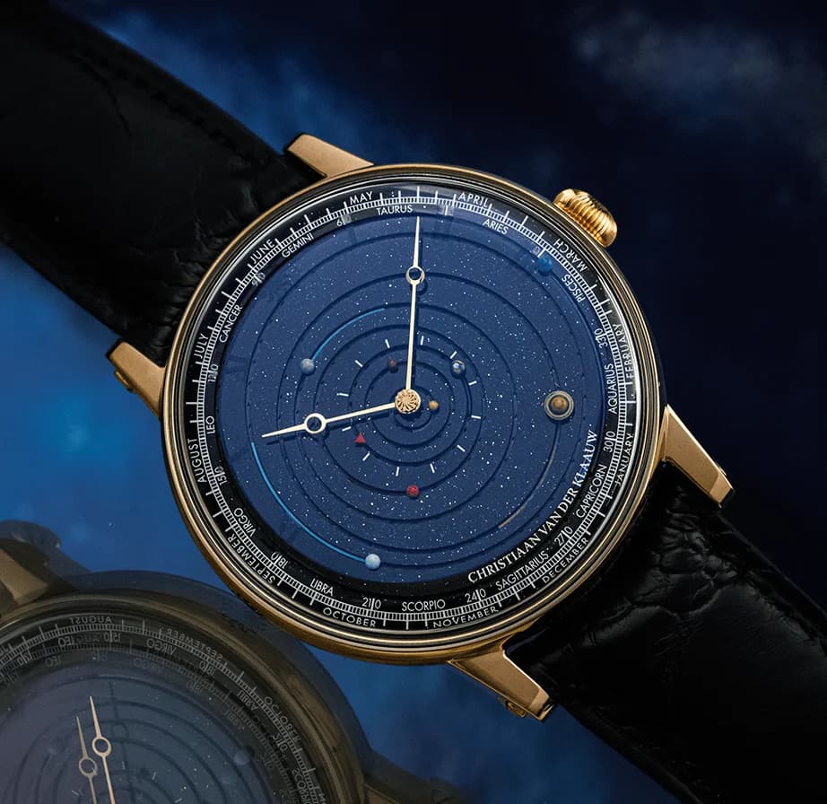Rose gold planetarium on a blue leather strap