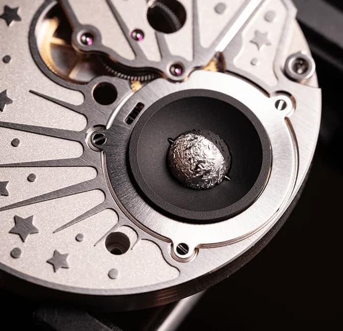 Miniature Moon set in a star-engraved dial plate
