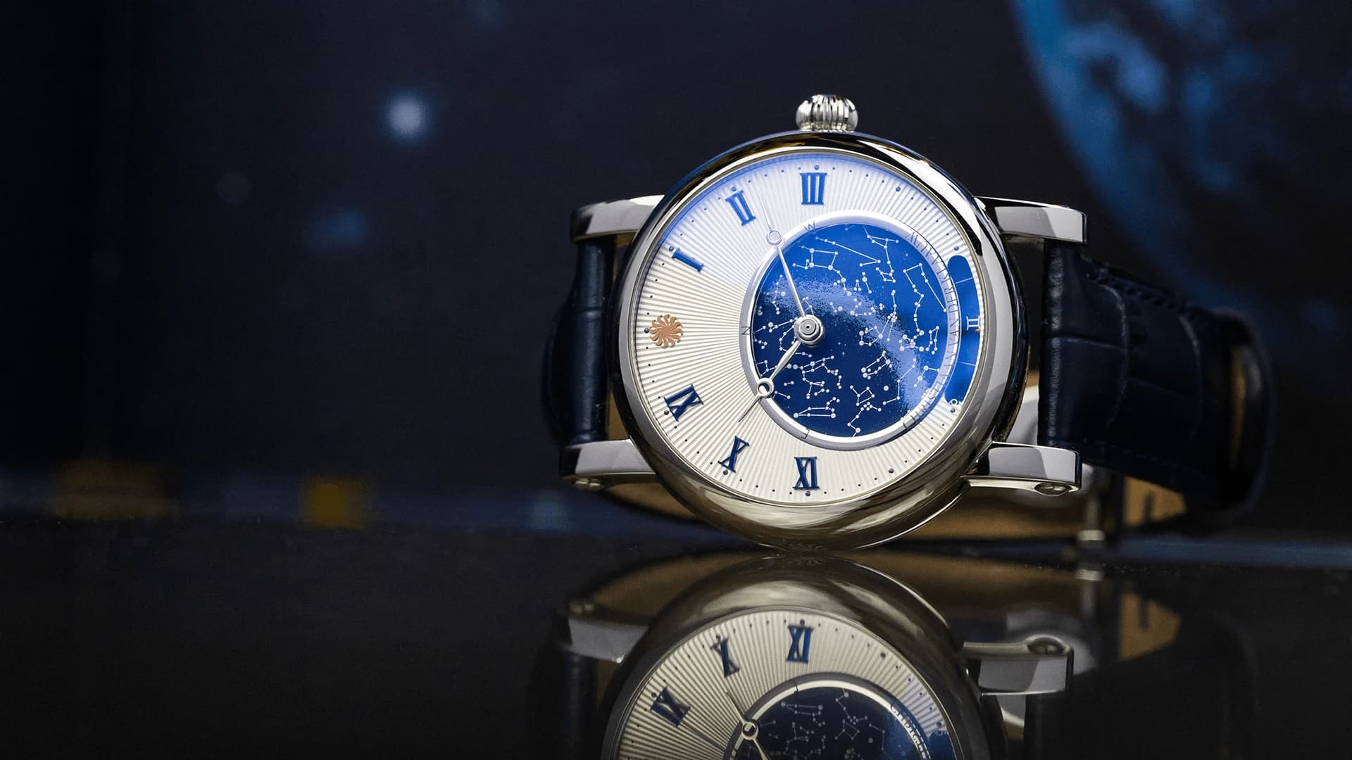 Collection of the Stars watch with a star-map dial against the night sky