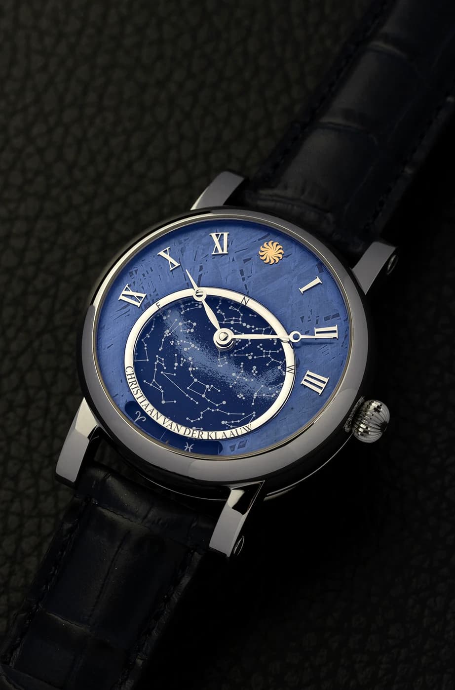 Blue dial watch on a dark leather strap