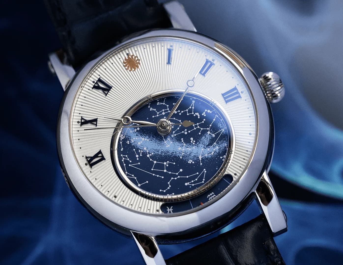 Orion with a rotating star map in a silver dial