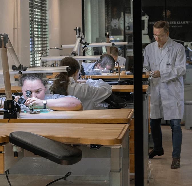 Watchmakers at work in the atelier