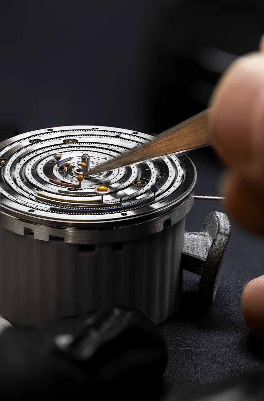 Setting a hairspring with tweezers