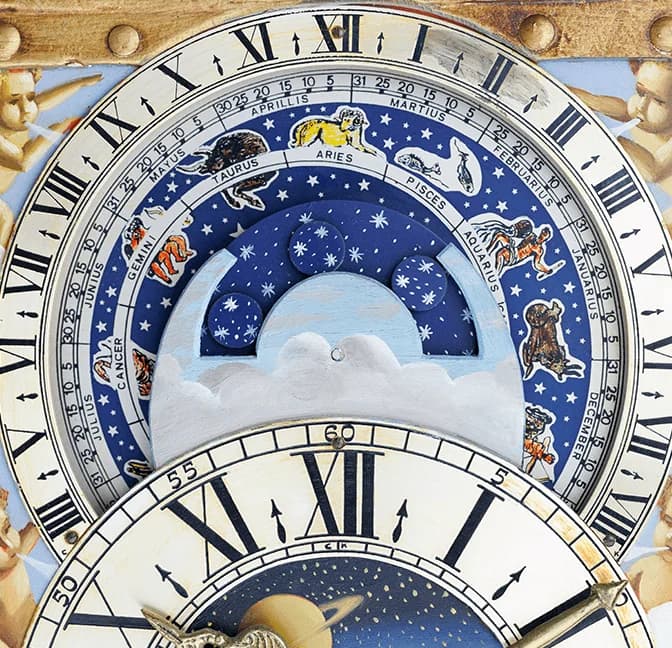 Astronomical clock dial with a moving night sky