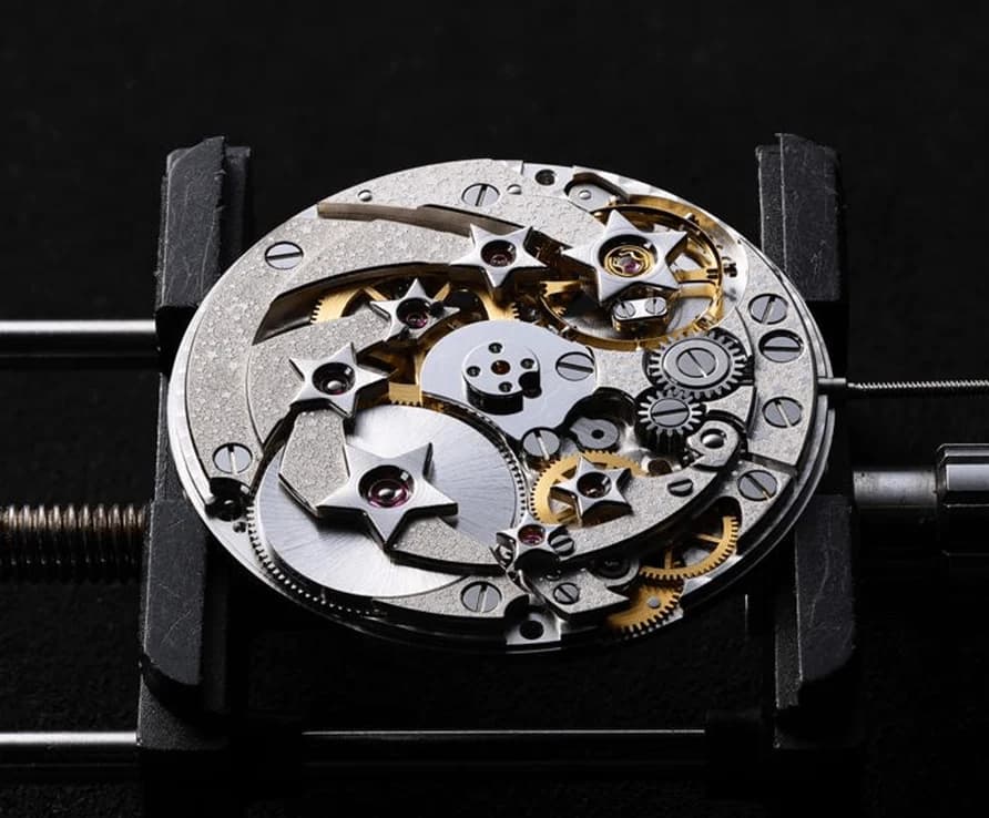 The Grand Planetarium mechanism in a holder