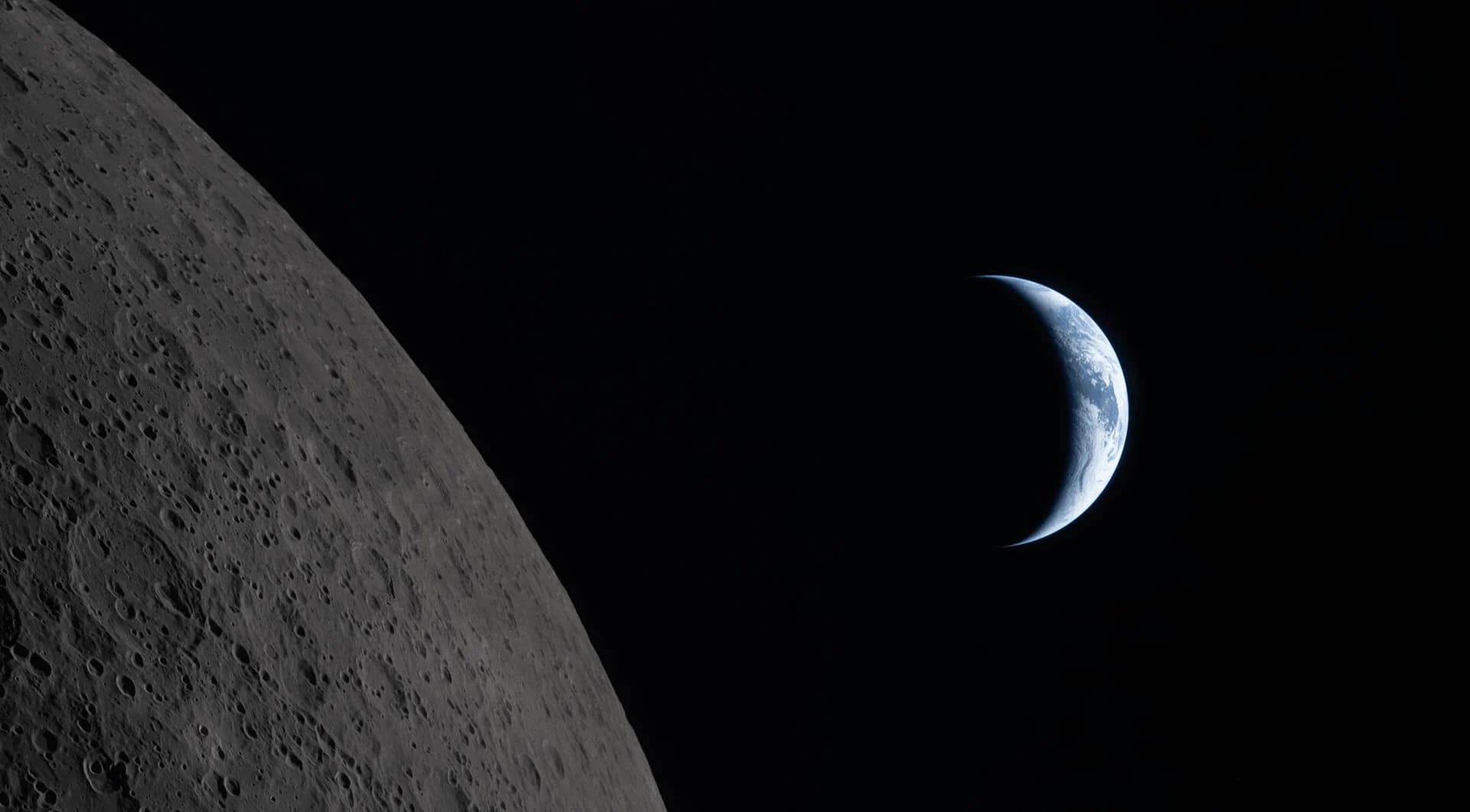 A crescent Earth rising beyond the Moon