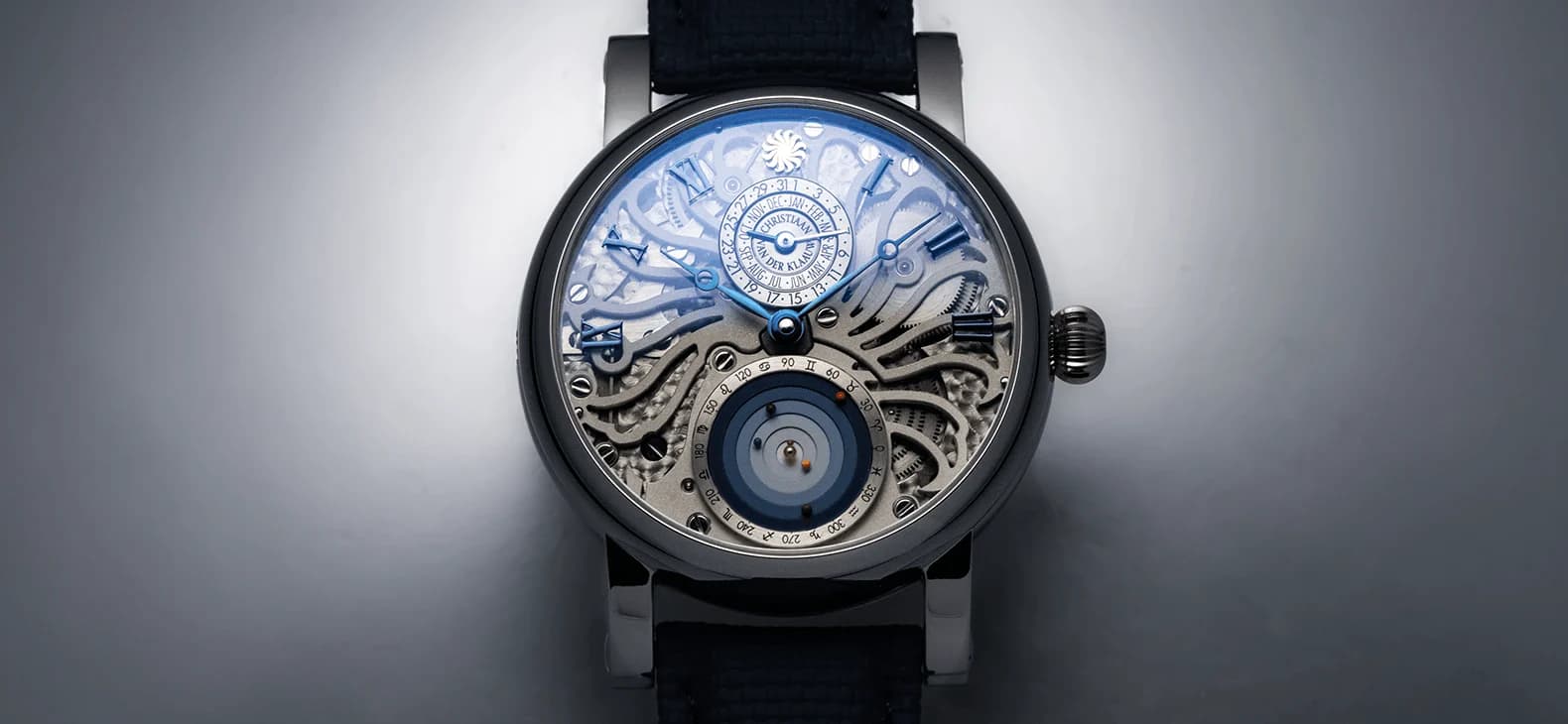 The transparent sapphire dial and the Planetarium at six o'clock