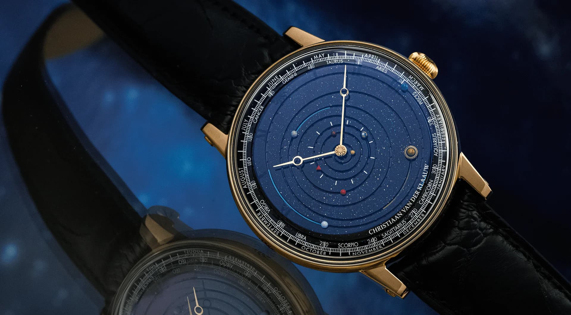 Grand Planetarium Eccentric in rose gold with a blue aventurine dial, reflected on glass