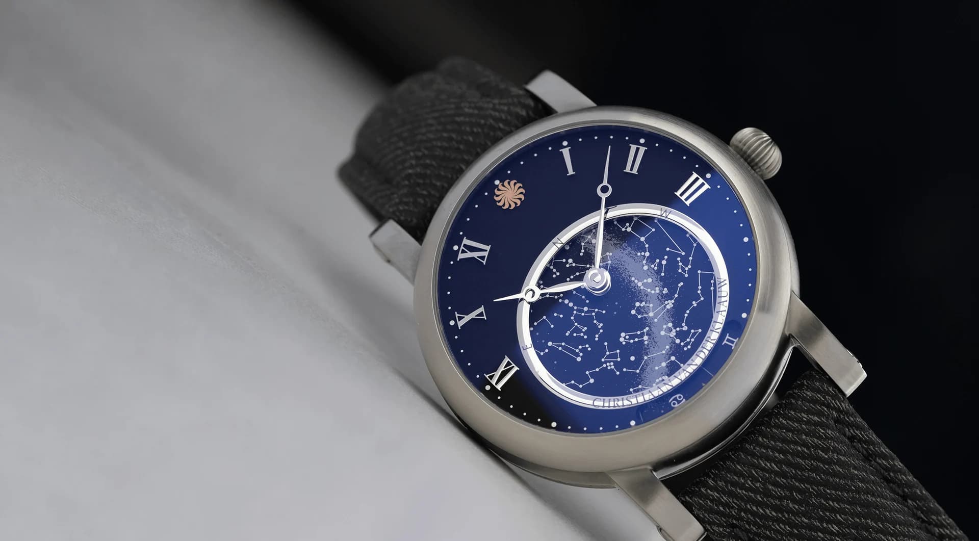 Orion Matt Black on the wrist: brushed titanium case, dark dial and rotating star map