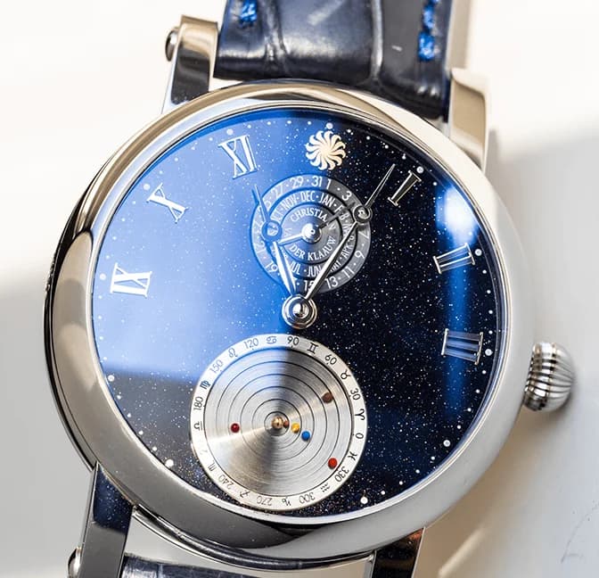 The mechanical Planetarium at 6 o'clock on the blue aventurine dial