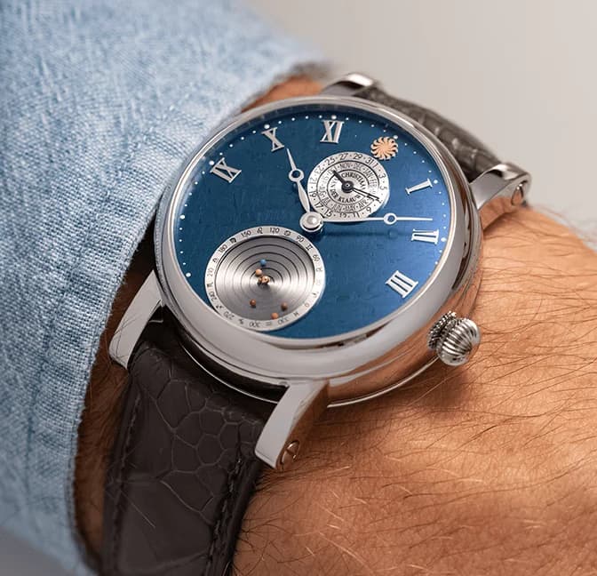 The mechanical Planetarium at 6 o'clock on the blue meteorite dial
