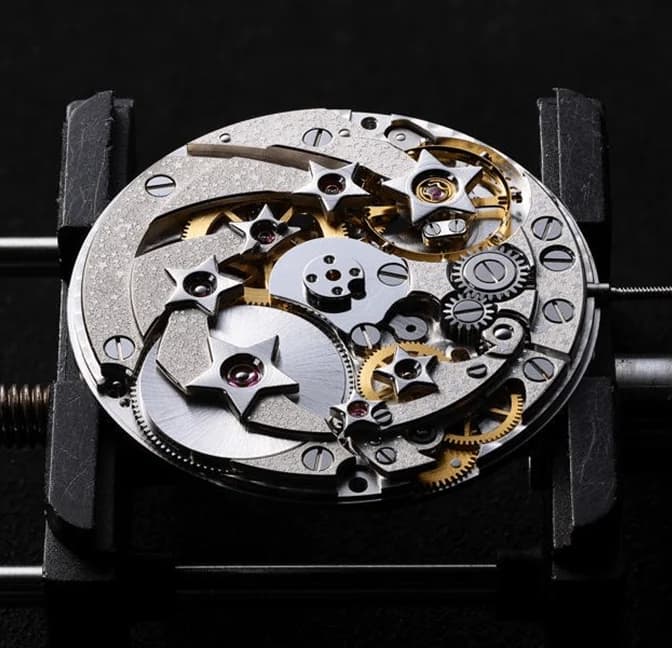 The mechanical Planetarium at 6 o'clock on the black onyx dial