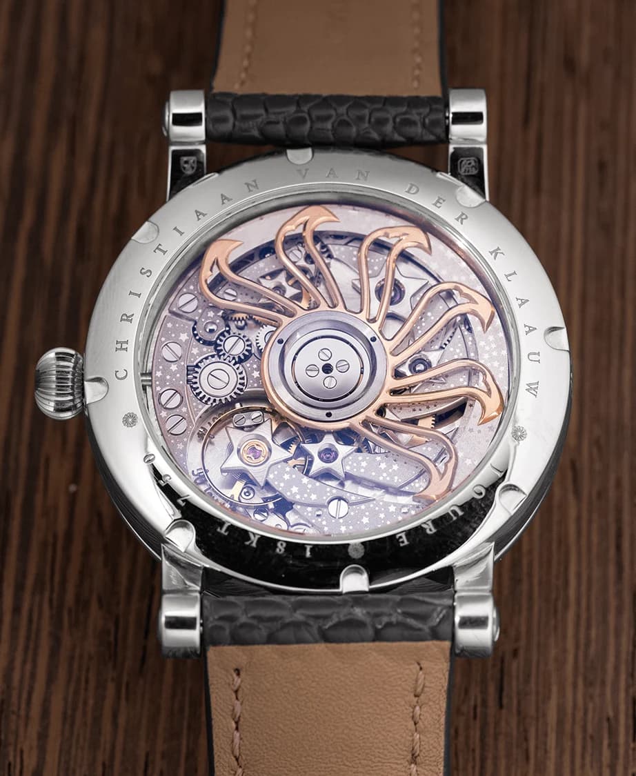 The CKM-01 Manufacture movement through the sapphire caseback
