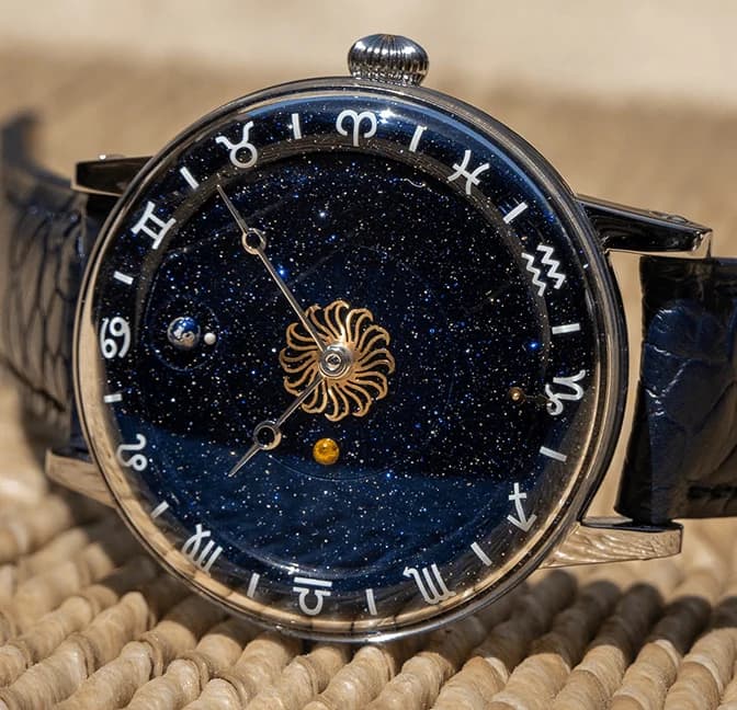 The blue aventurine dial with Venus, Earth and the Moon